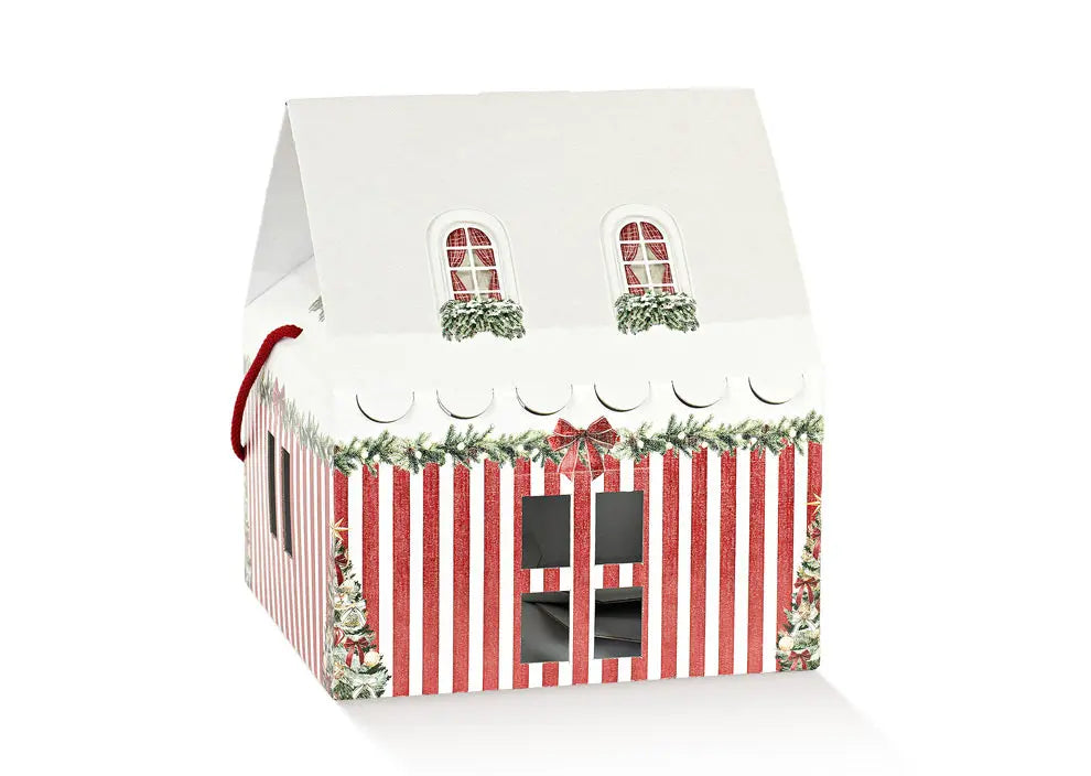 A small white house-shaped gift box with red and white vertical stripes on the lower half, green holly and pine garland details, two arched window cutouts on the roof, and a red hanging ribbon loop on the left side, shown on a white background.